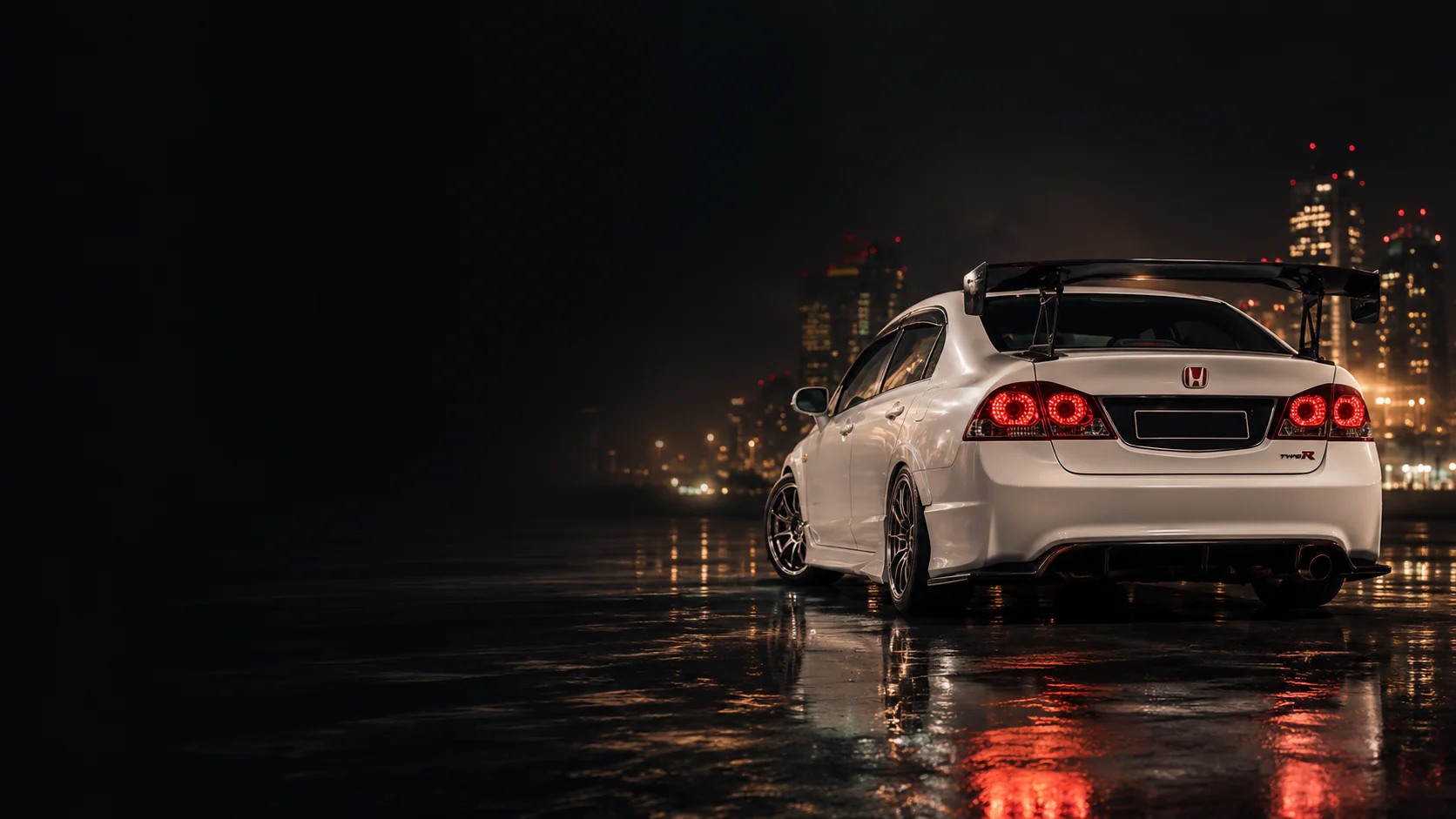 A JDM car scene under night lights.